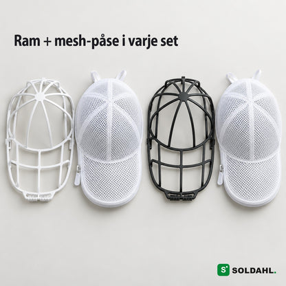 Vad som ingår: vit och svart ram med varsin vit mesh-påse, ovanifrån